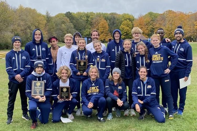 Cross Country teams posing with awards.