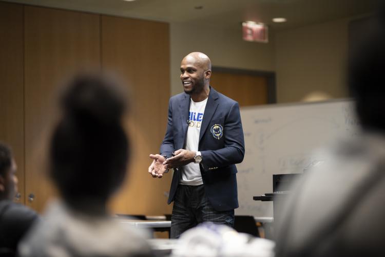 Andre Fields talks to GRPS high school students at Raider Nation Day.