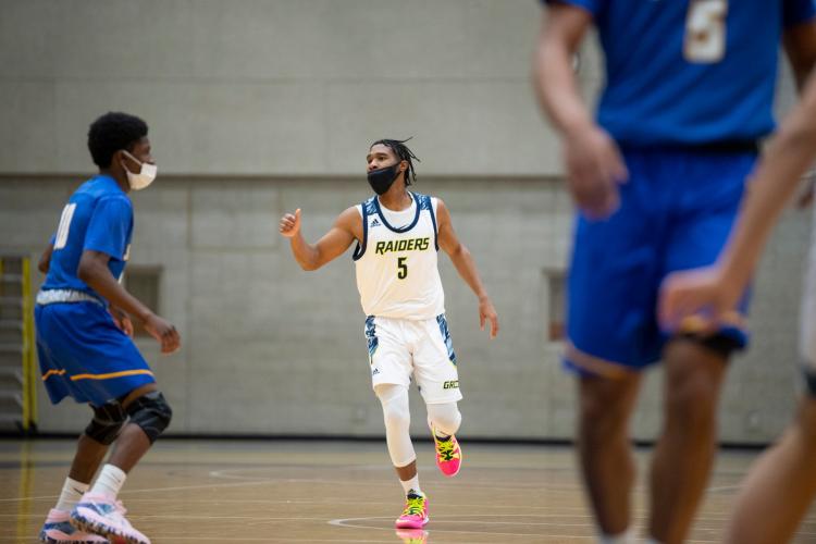 GRCC Raiders men's basketball team in action.