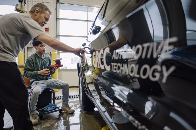 Instructor Chad Lodenstein working with a student.