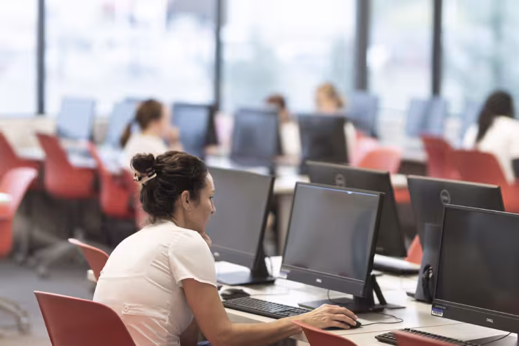 Students working on computers in a Cook Hall lab. 