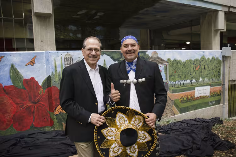 Dr. Juan Olivarez with artist Raymond Trujillo.