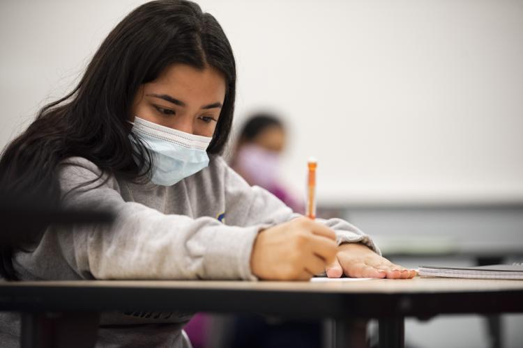 A student working in a pre-algebra classroom.