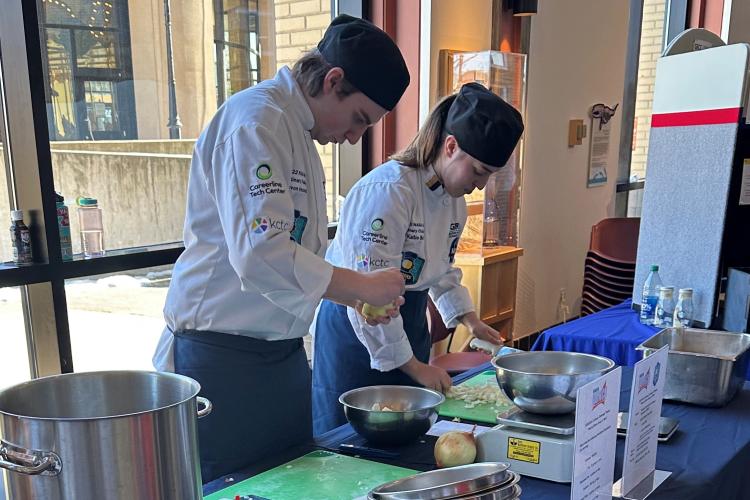 Devon Vanderwall and Katie Bird preparing their meals in a preliminary round of the competition.