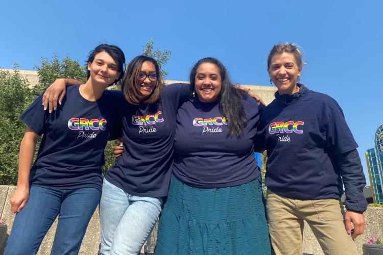 GRCC team members showing off the GRCC Pride shirts that will be handed out at the Pride events.