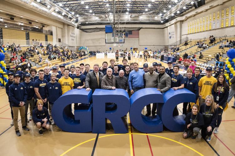 Homecoming in 2019 with athletes past and present gathered at the large letters.