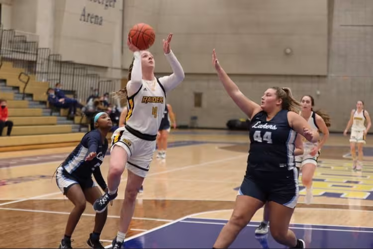Grace Lodes jumping for a basket.