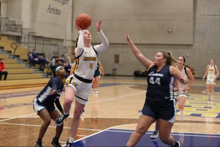 Grace Lodes jumping for a basket.