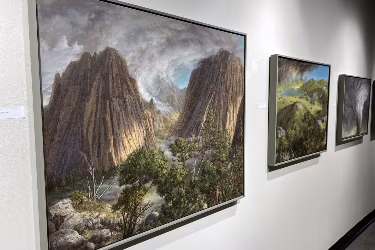 Paintings on display in the gallery.