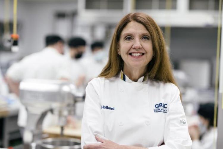 Portrait of Jodi Holland in her Secchia chef's coat.