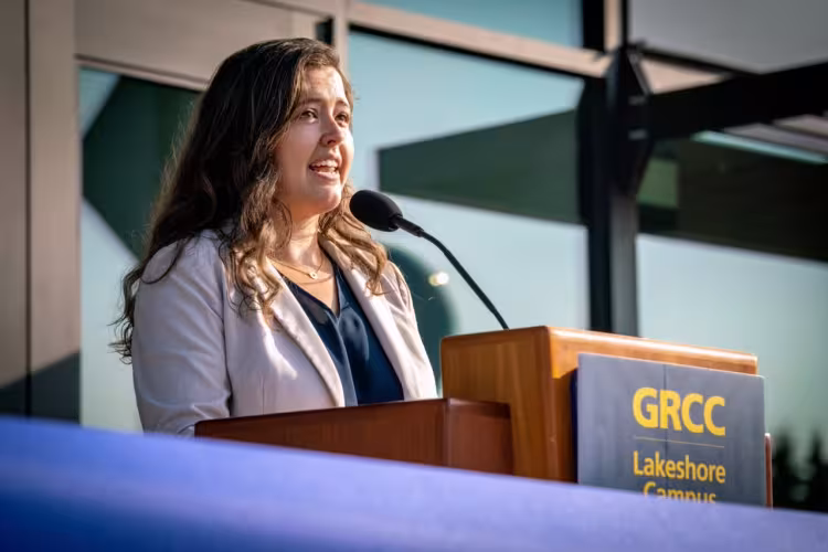 Kelsey Sivertson  speaking at the ribbon-cutting. 