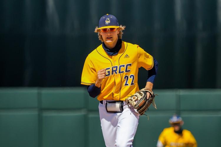 GRCC baseball player running on the field.