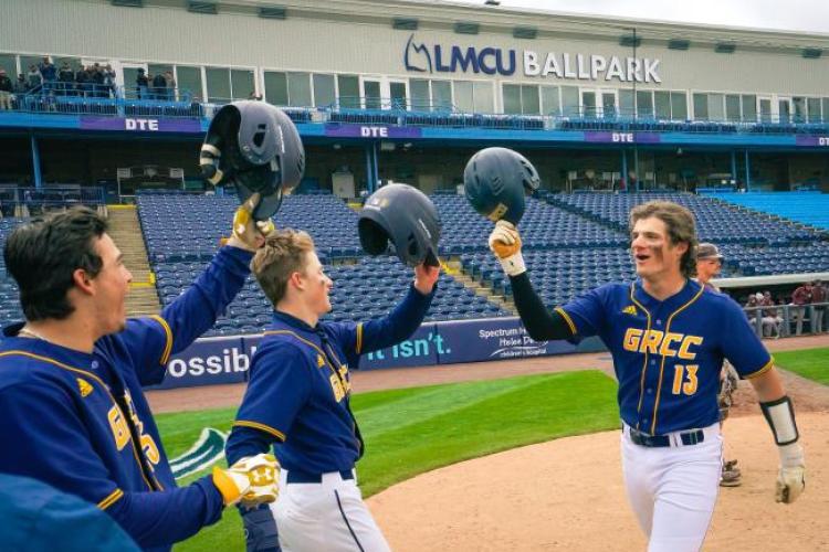 GRCC baseball players celebrating after a home run.