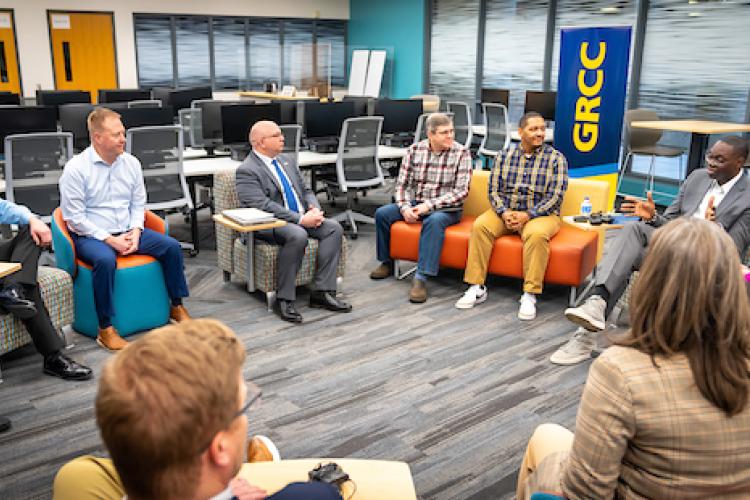 A group of people at GRCC speak with Lieutenant Governor Garlin Gilchrist II