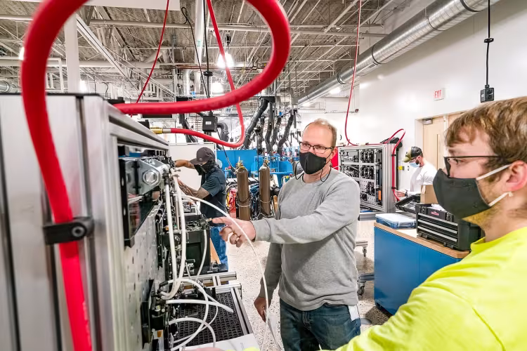 A professor and student working in the GRCC Lakeshore Campus manufacturing lab.