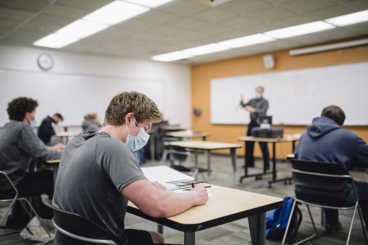 Students listening to the professor in a math class. 