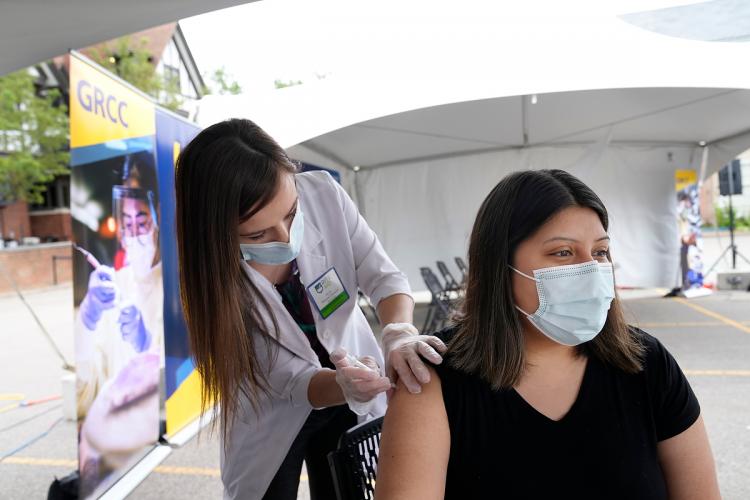 A student receiving a vaccination at a GRCC clinic.