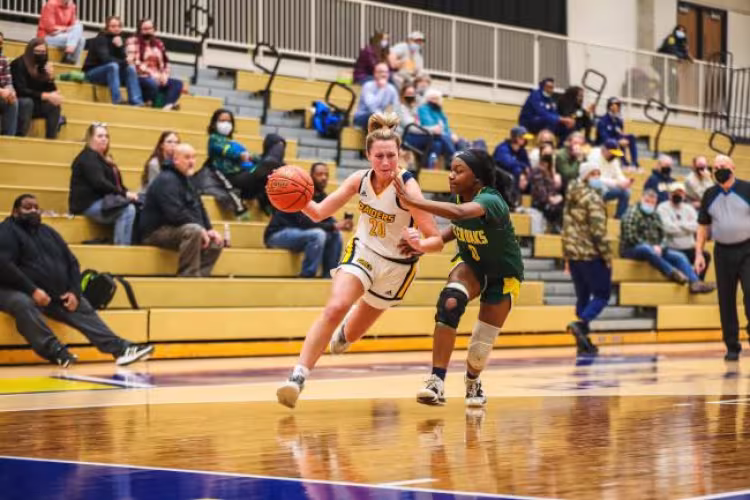 Sally Merrill driving to the basket.