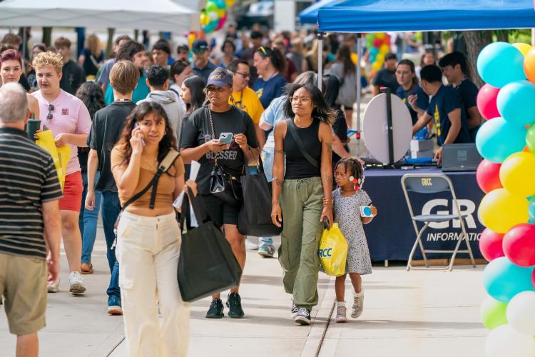 Students on campus participating in an enrollment event