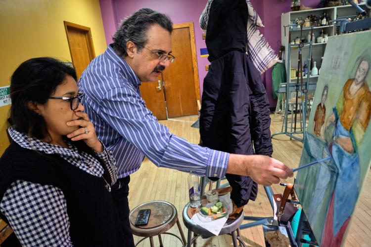 Art professor Nick Antonakis working with a student.