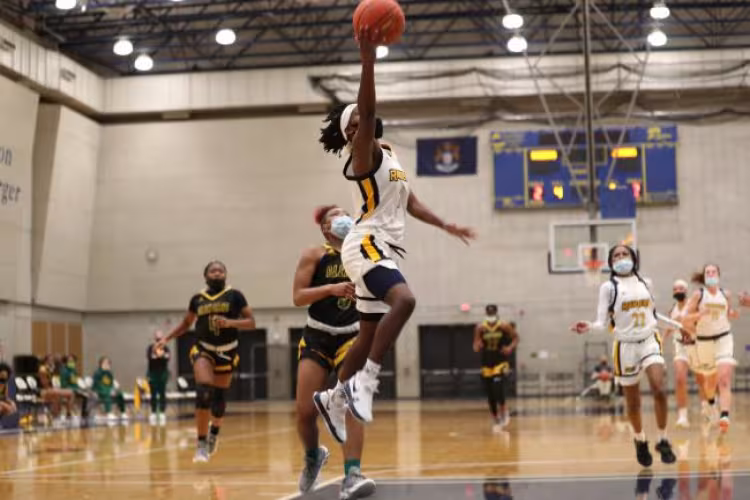 Eurasia Green-Boyd leaping to make a shot.