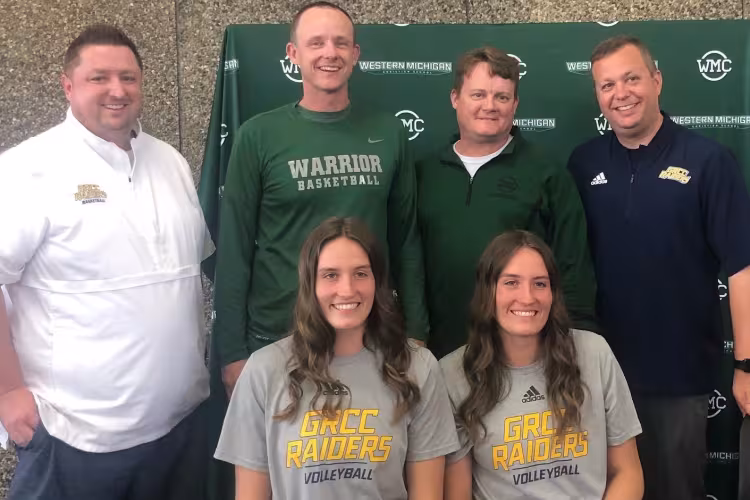 Maddie and Kyla Wiersema with GRCC and West Michigan Christian coaches.