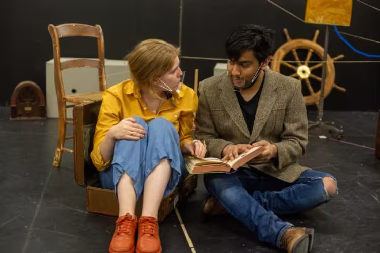 A rehearsal photo showing Carlos Caracheo Trujillo and Emily Page.