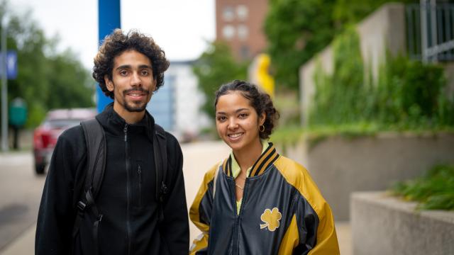 Two students smiling