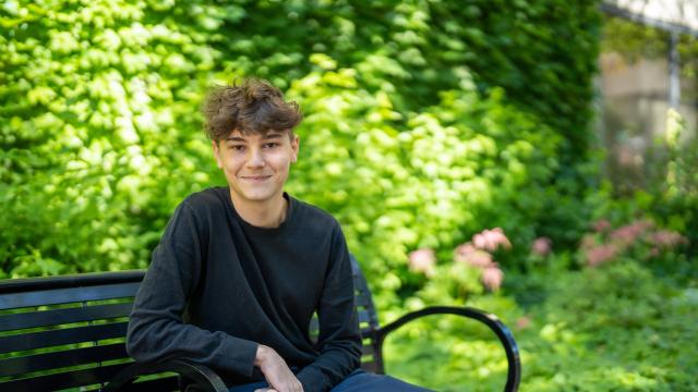 Student sitting outside on campus