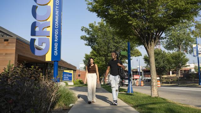 Two students walk past the GRCC Early Childhood Learning Laboratory.
