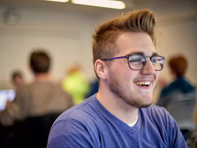 Student laughing in classroom