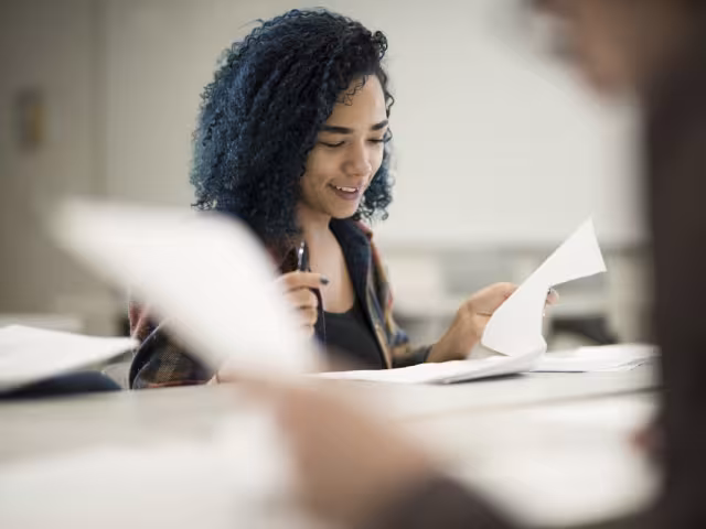 Student reviewing a paper