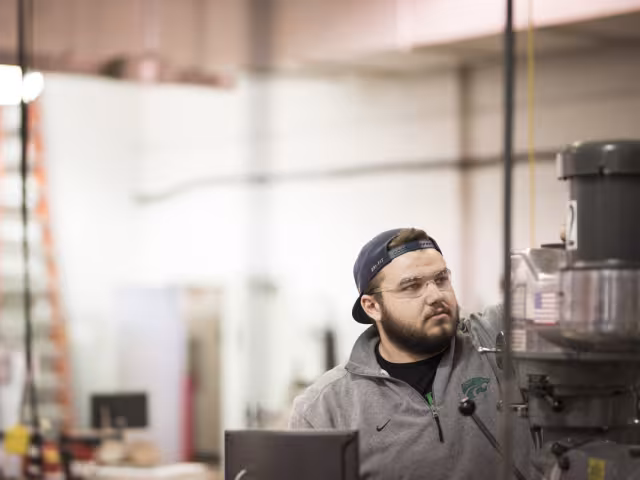Student working on a machine