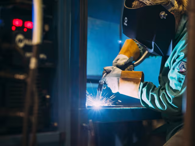 Student using welding torch