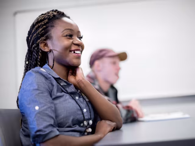 Student laughing in classroom