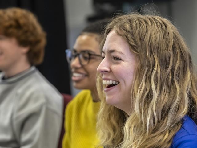 Students laughing during a theater class