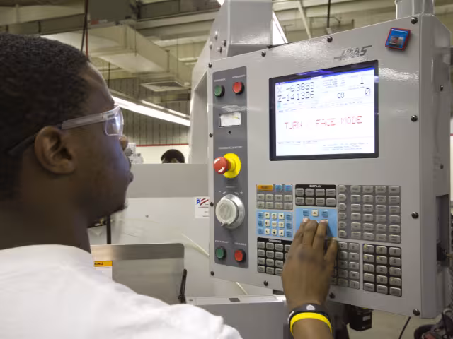 Student working on machine tool technology.