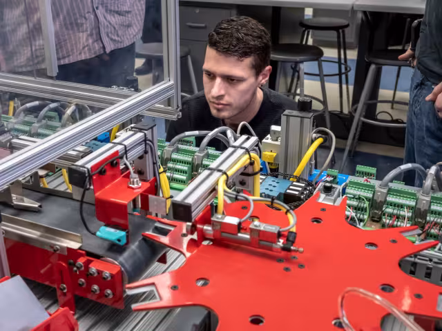 Student working on a machine
