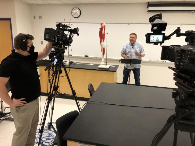 Media lab filming a professor in a classroom