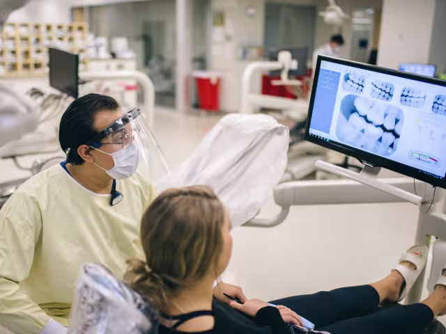 A dental student practicing on real patients in GRCC's Dental Clinic.