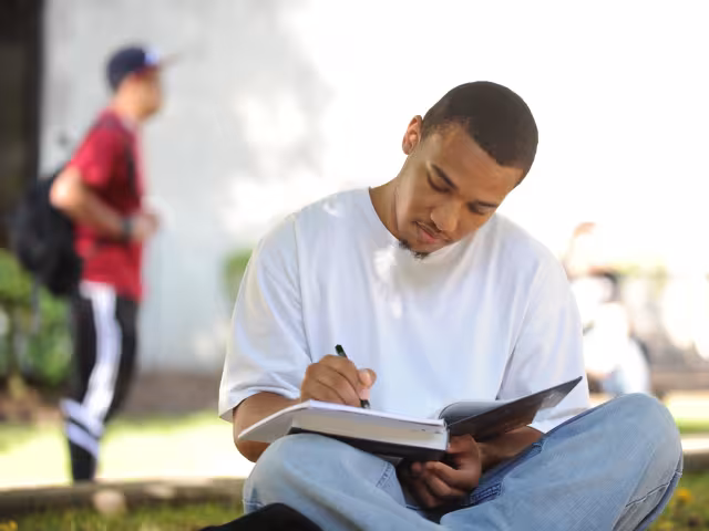 Student studying on the commons