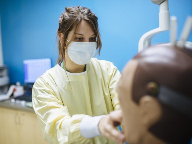 Health student working on a dummy