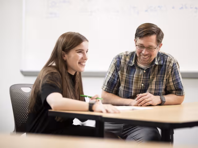 Student and teacher in classroom