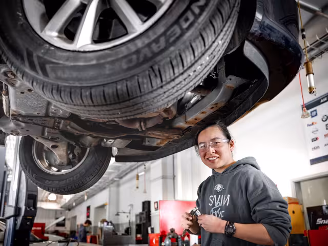 Student working on car