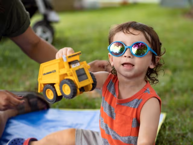 A child playing with a truck at a Play and learn playgroup