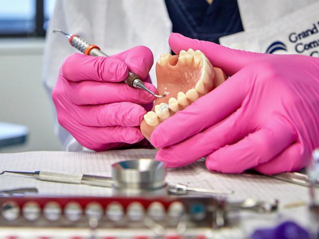 Dental student working on teeth
