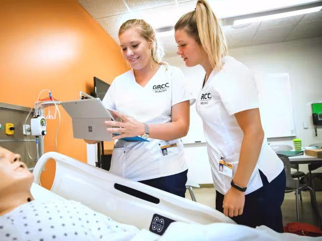 Nursing students reading a chart