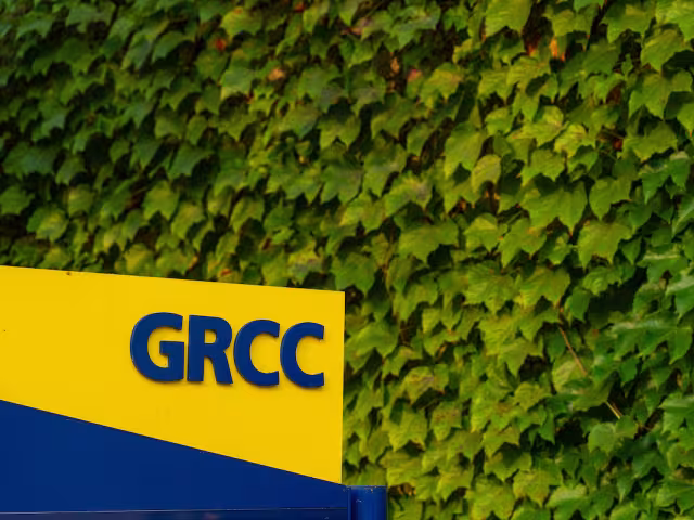 A blue and yellow GRCC sign on campus.