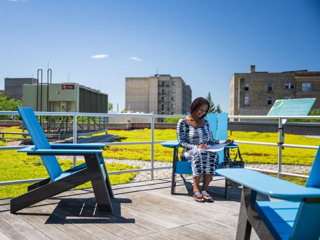 Student studying on the ATC green roof top.