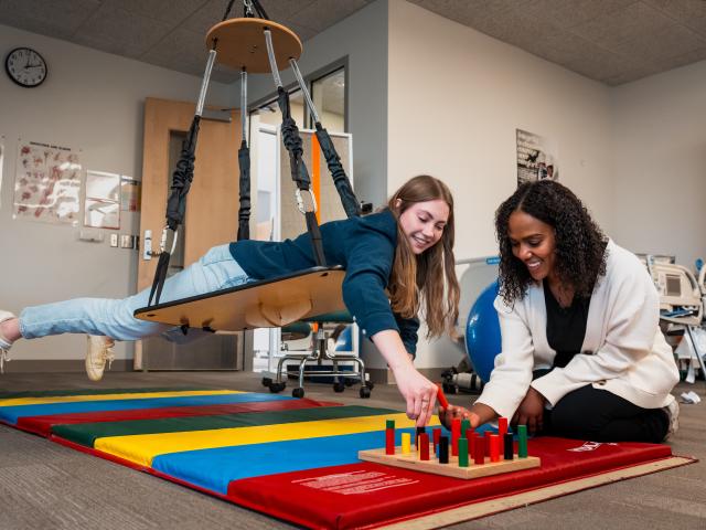Occupational Therapy Assistant students working with therapy blocks